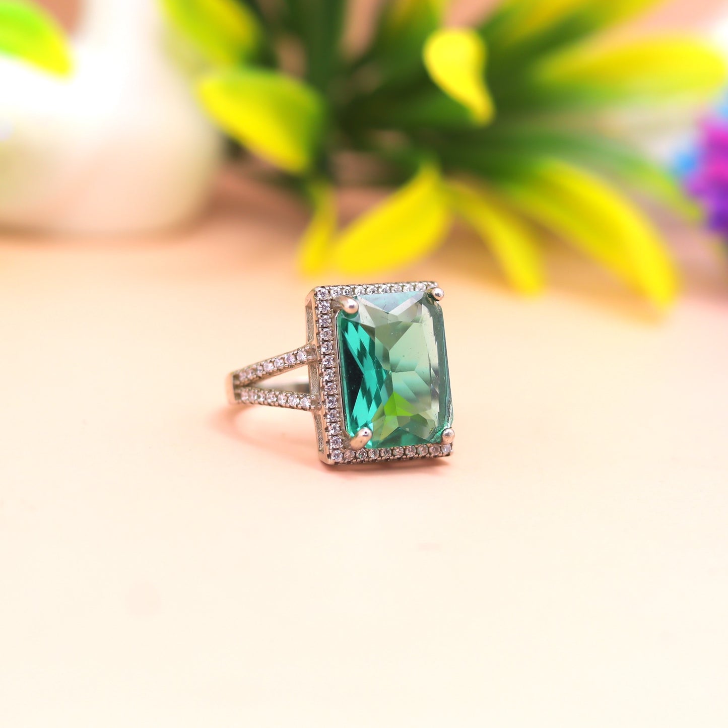 Emerald Radiance Halo Silver Ring